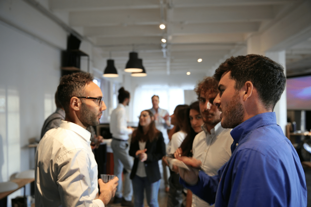 A small group of people talking during a break at an event